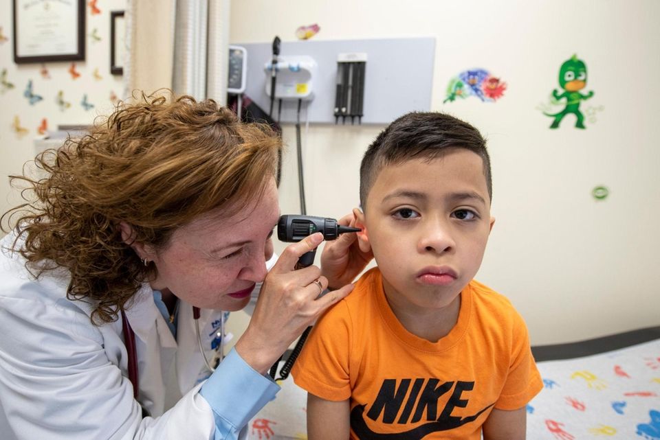 Checking ears. Photos of six year old Jesus