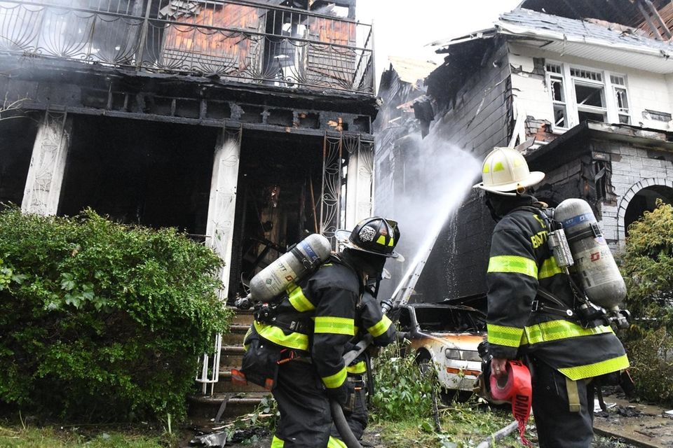 A five alarm fire raced through three 100+