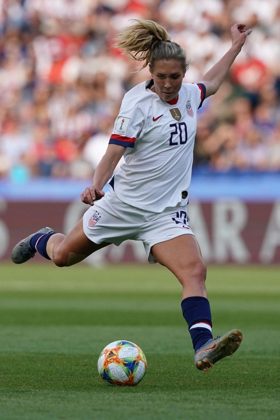 United States midfielder Allie Long kicks the ball