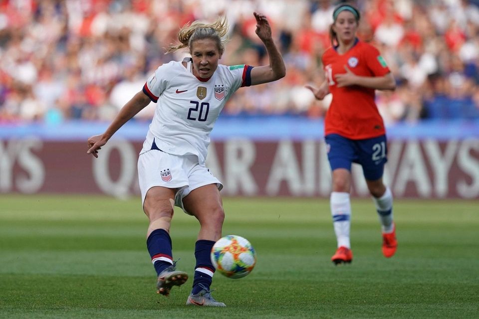 United States midfielder Allie Long kicks the ball