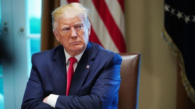 President Donald Trump listens during a working lunch... President Donald Trump listens during a working lunch