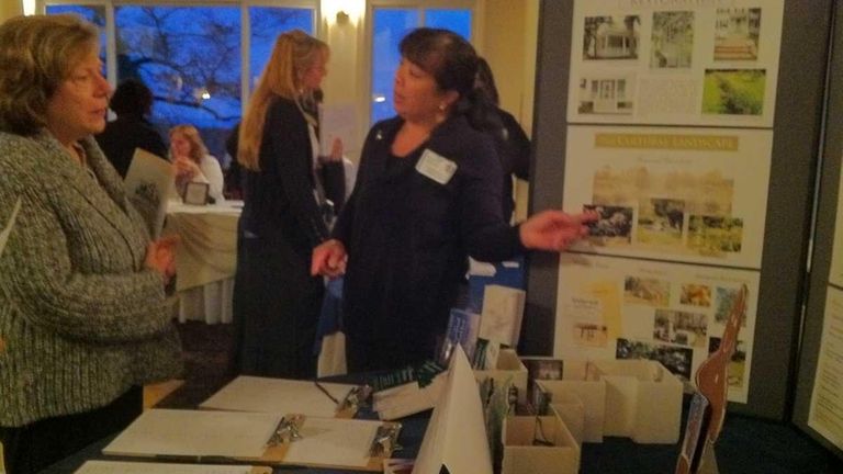 Carol Zegel, of Bayport, talks with Phyllis Chan