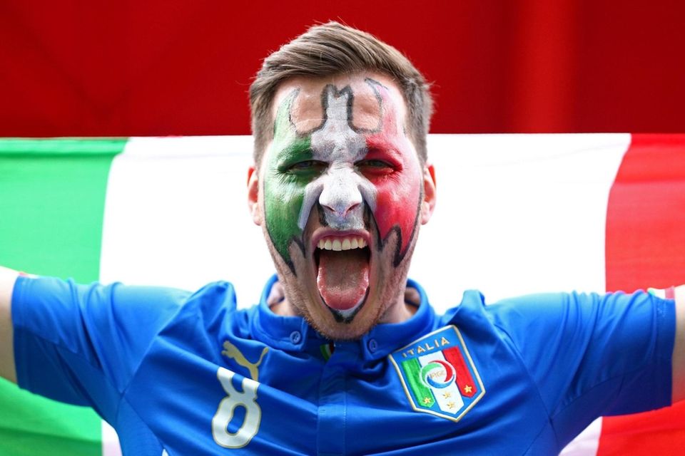 A fan of Italy prior to the FIFA