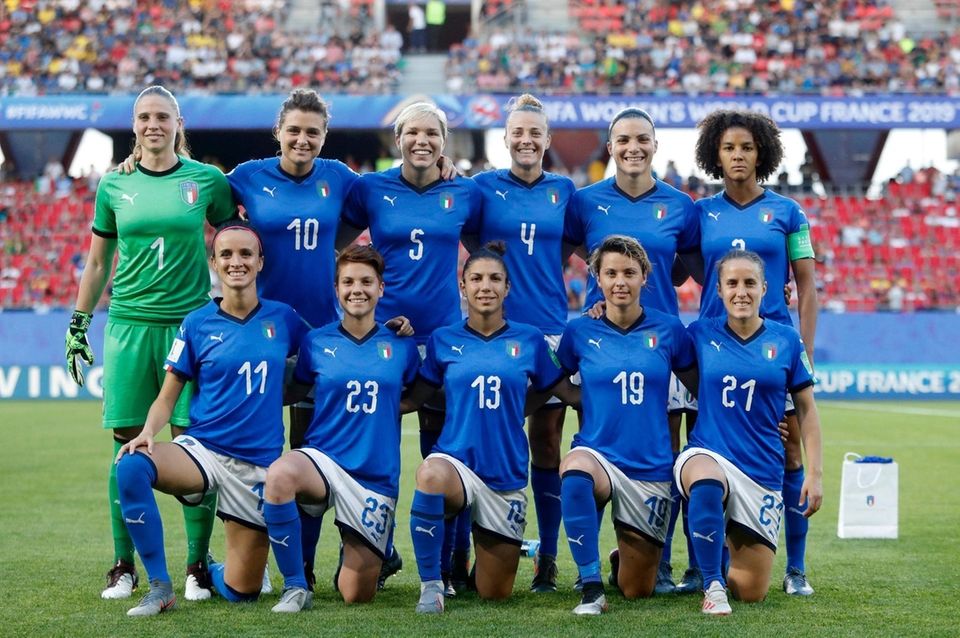 Italy players pose for a photo before a