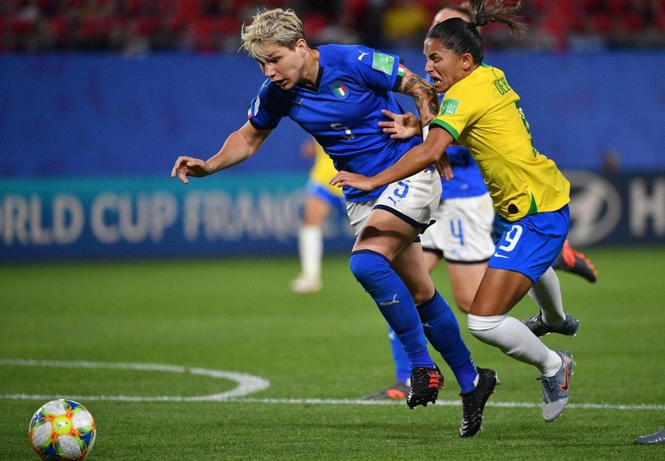 Brazil's forward Debinha (R) is fouled by Italy's