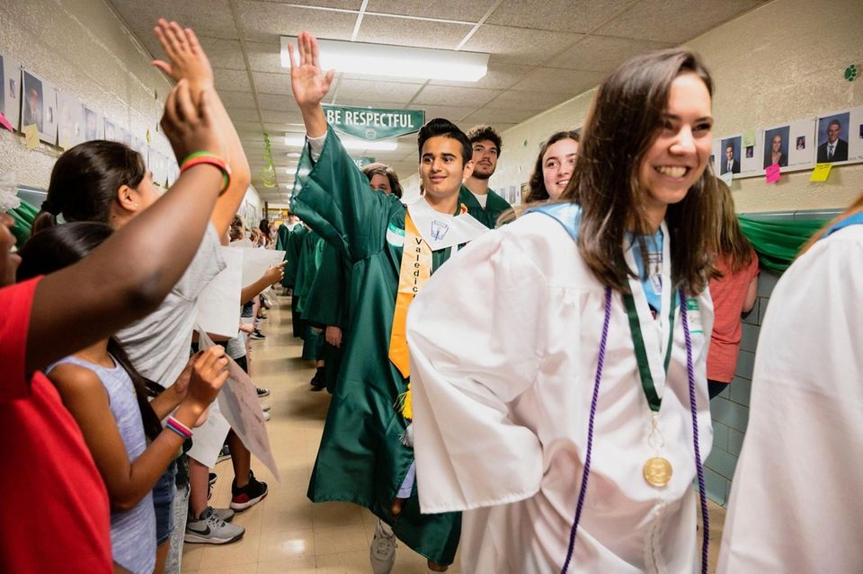 Farmingdale High School Valedictorian Kunj Patel high fives