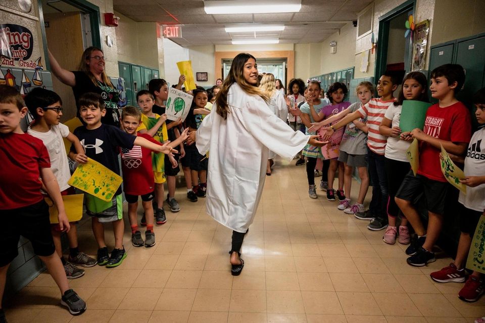 Farmingdale High School Senior Emily Diaz is greeted