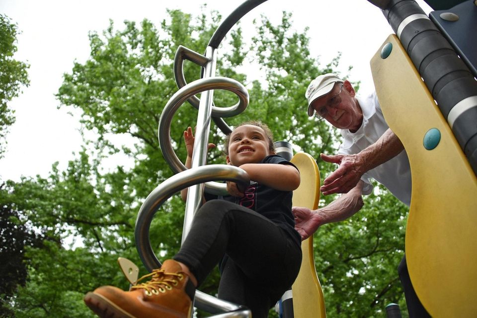 Grace Adorno, 2, of Hicksville, climbs on the
