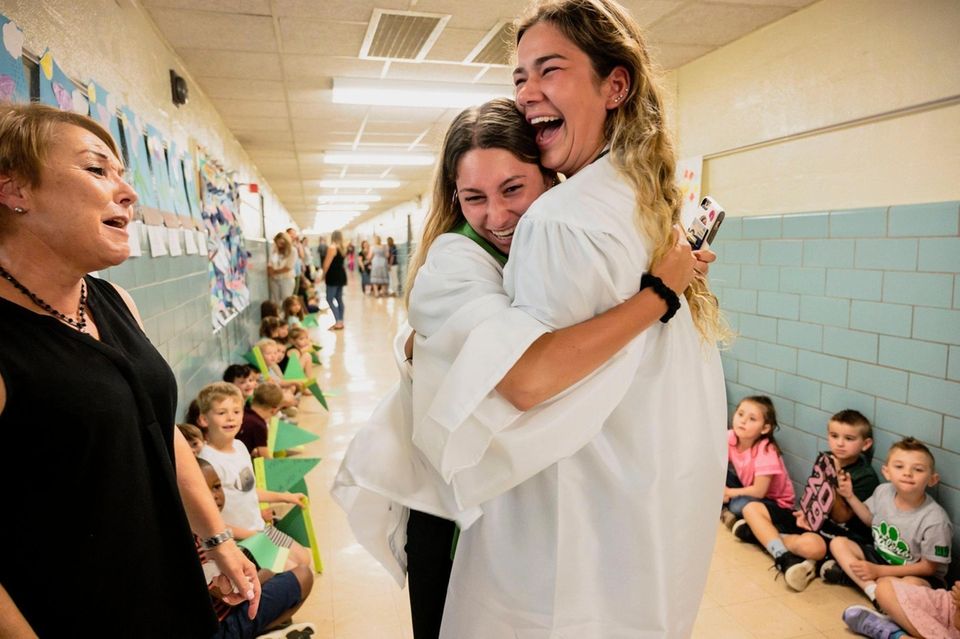 Farmingdale High School Seniors Stephanie Birkl (center) and