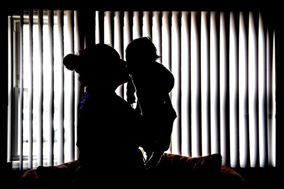 Maria, an immigrant from Honduras, has given birth