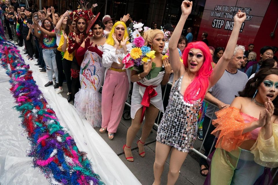 Drag queens celebrate on West 42nd Street after