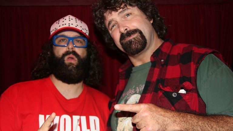 Mick Foley, right, hangs out with