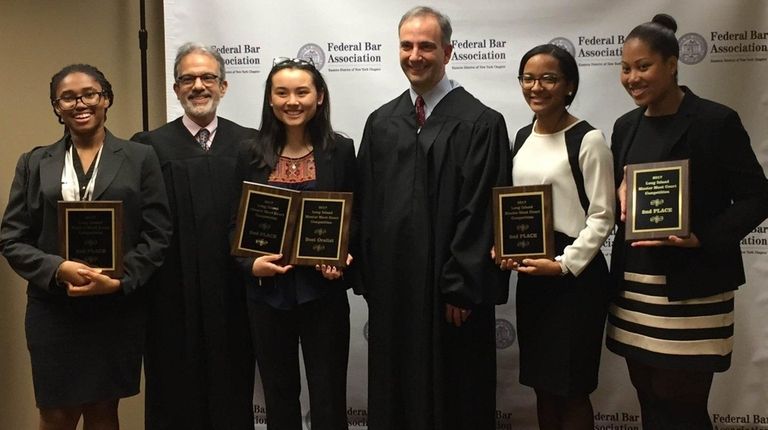 Magistrate Judge Gary R. Brown, second from left,