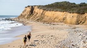 Surfers hunt Long Island waves near Camp Hero
