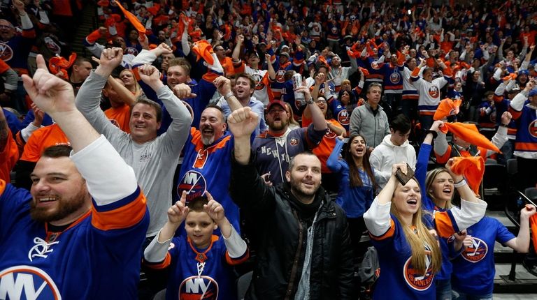 Islanders fans celebrate a goal during the second