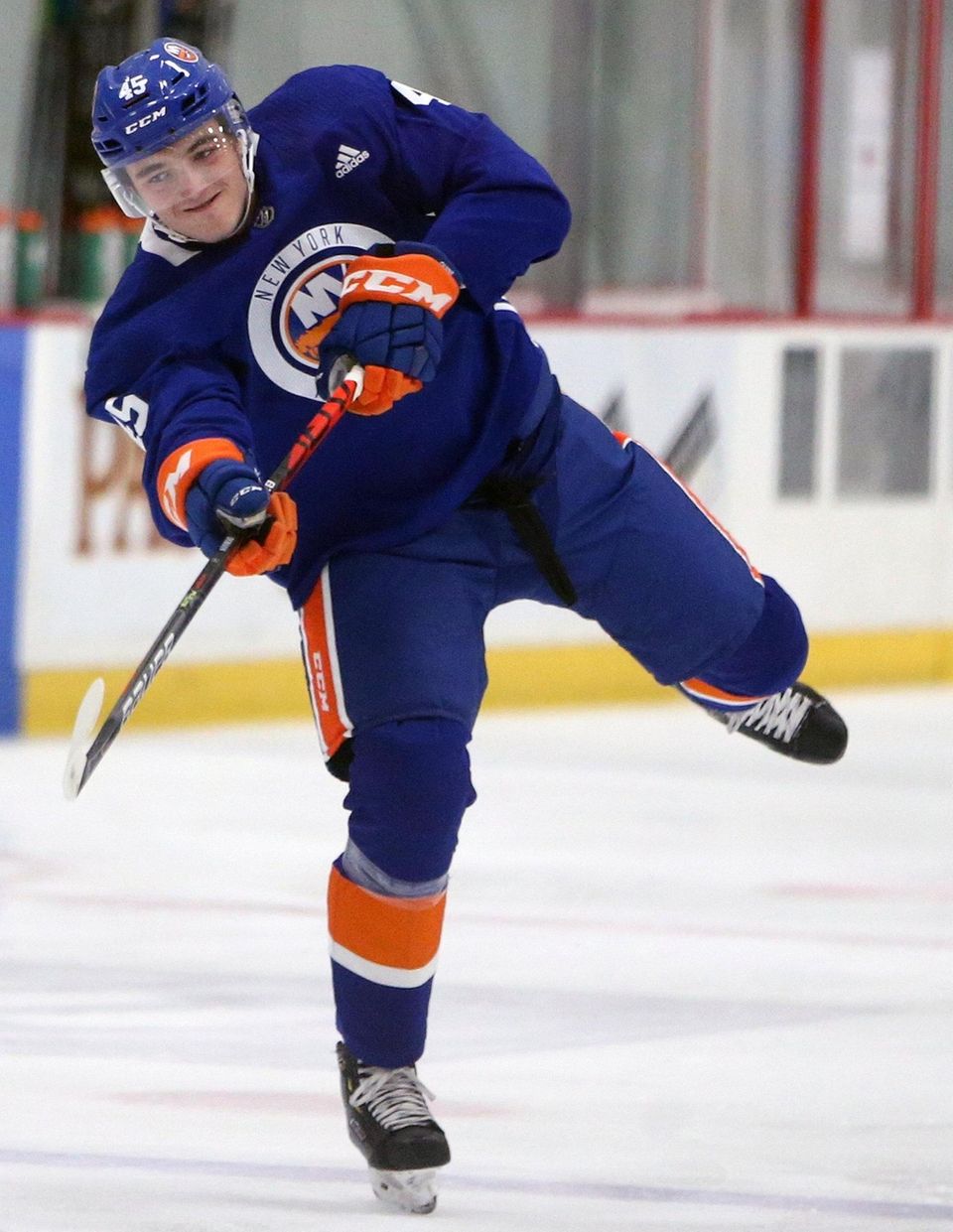 Defenseman Noah Dobson shoots puck as Islanders have