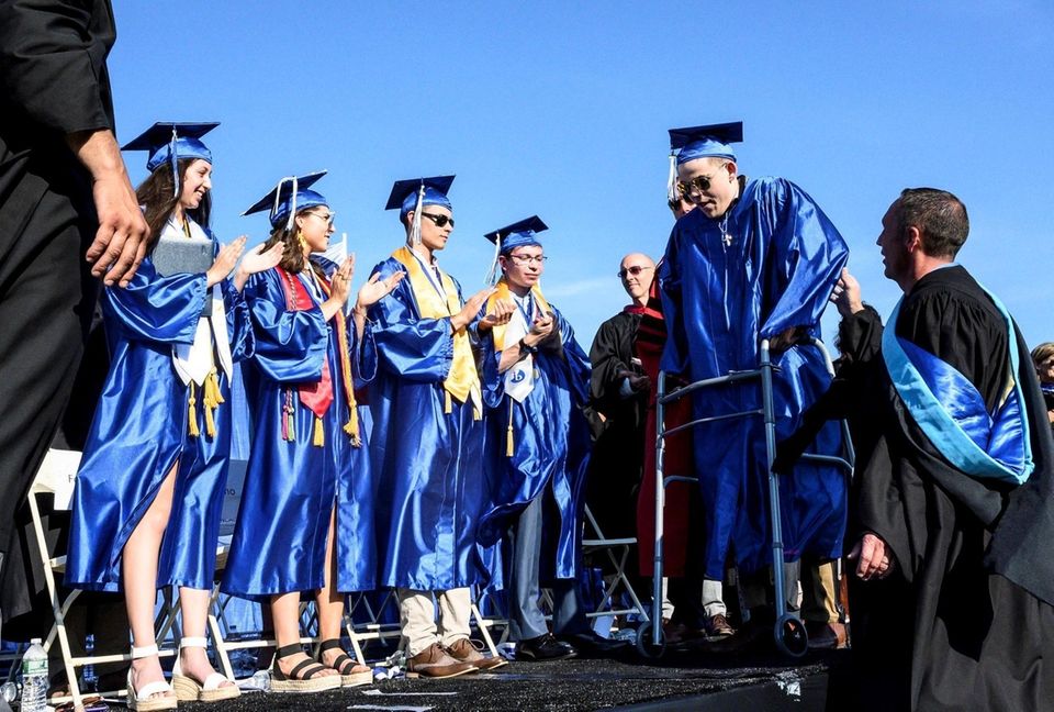 Robert Browne walks across the stage with the
