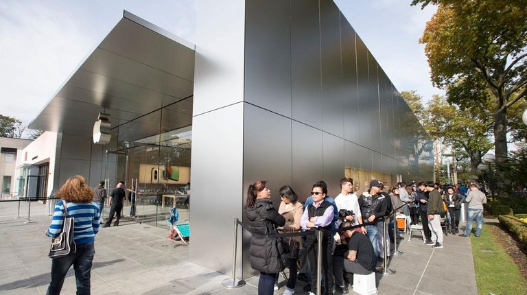 Shoppers in Manhasset wait to purchase the newest