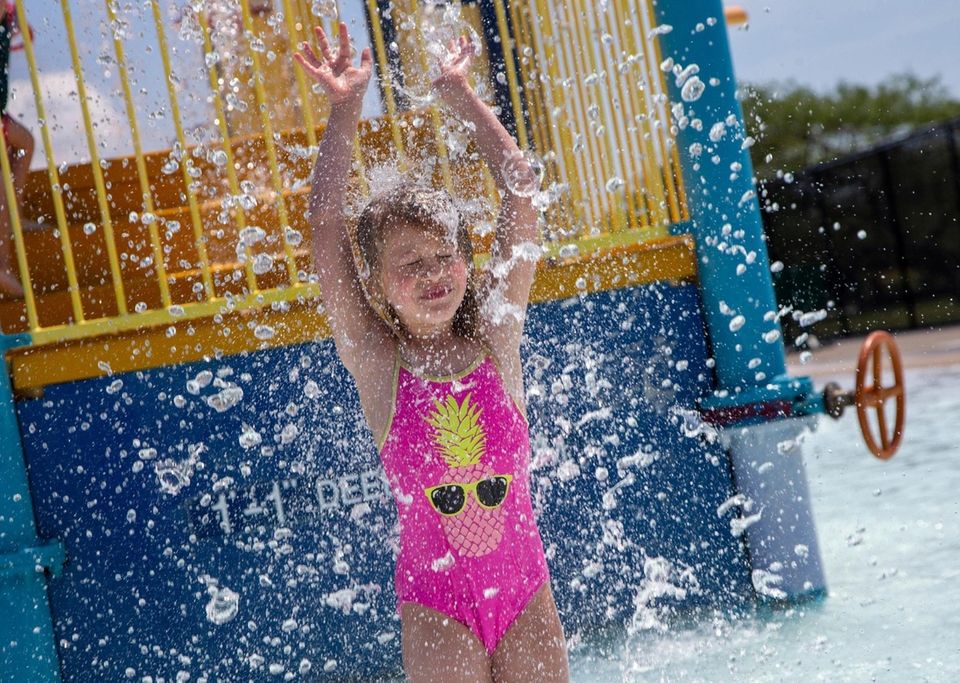 Sadie Rose, 7 Seaford, runs though the splash