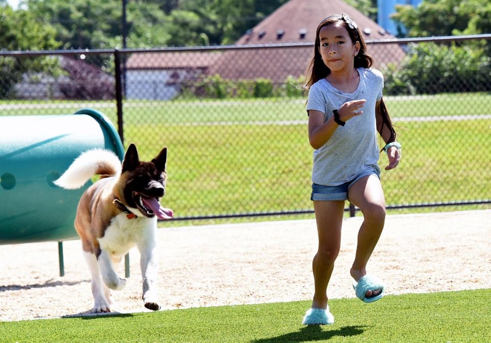 Sarah Rojas, 9, of Mineola, plays with her