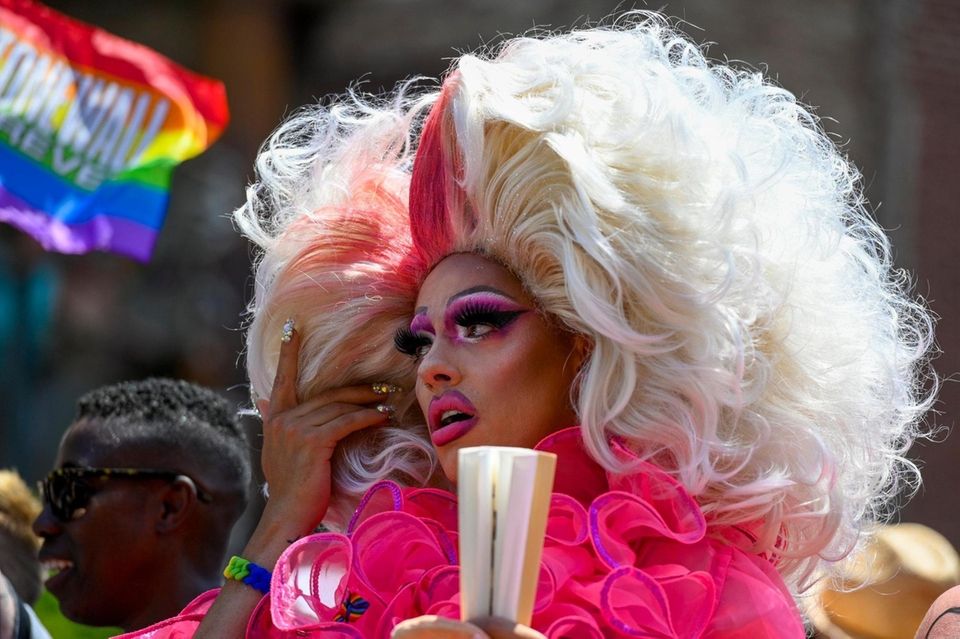 A participant rides on a float during the