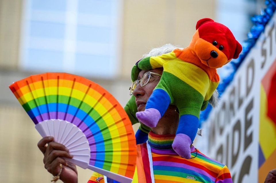 A participant rides on the World Pride NYC