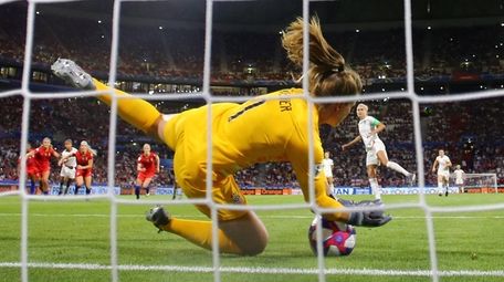 Alyssa Naeher of the U.s. saves a penalty