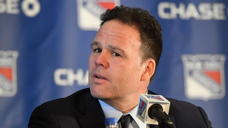 Rangers general manager Jeff Gorton looks on at