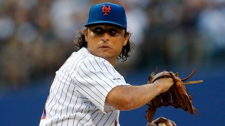 Jason Vargas #44 of the Mets pitches during
