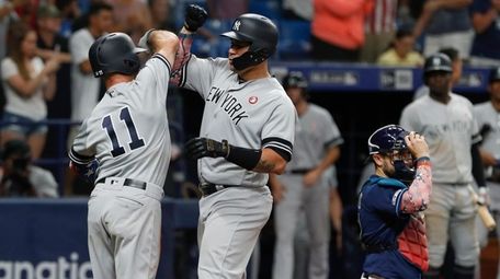 New York Yankees' Gary Sanchez, center, celebrates with