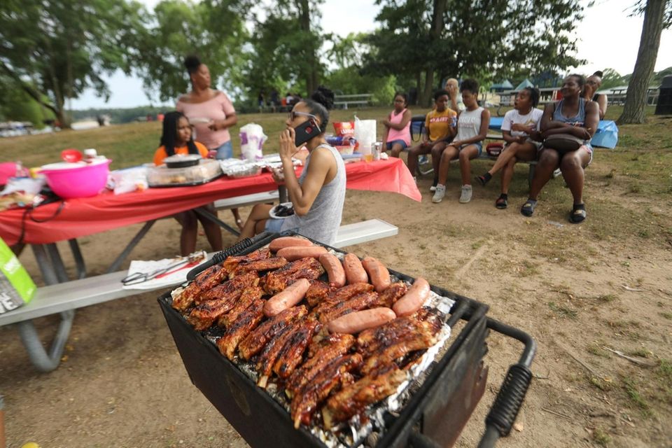The Henderson family, of Medford, hosts a cookout