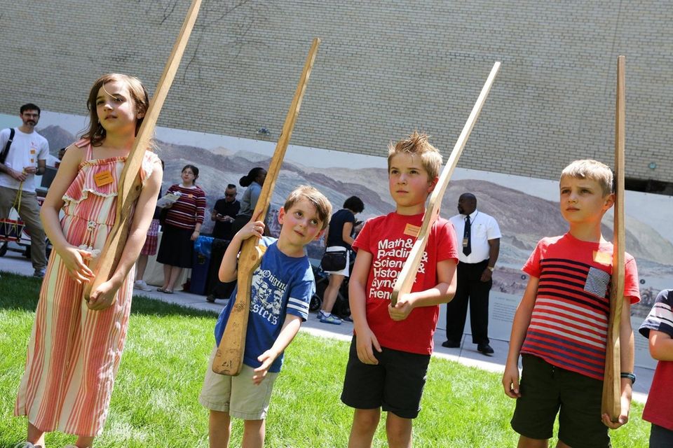 Children learn how to hold a bayonette in