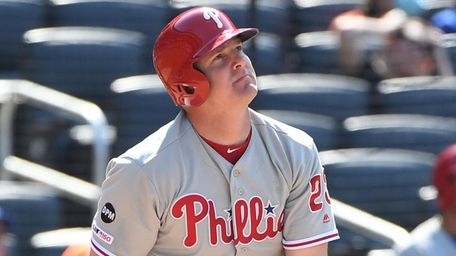 Phillies' Jay Bruce watches the flight of his