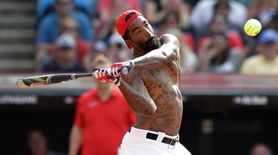 J.R. Smith hits during the MLB All-Star Legends