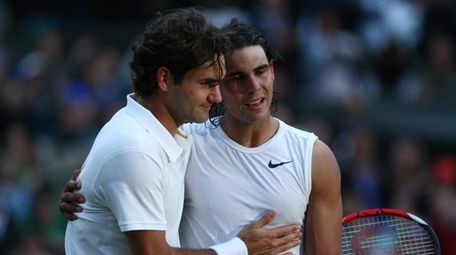 Rafael Nadal, right, is congratulated by Roger Federer