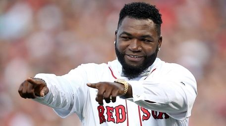 Former Red Sox player David Ortiz reacts during