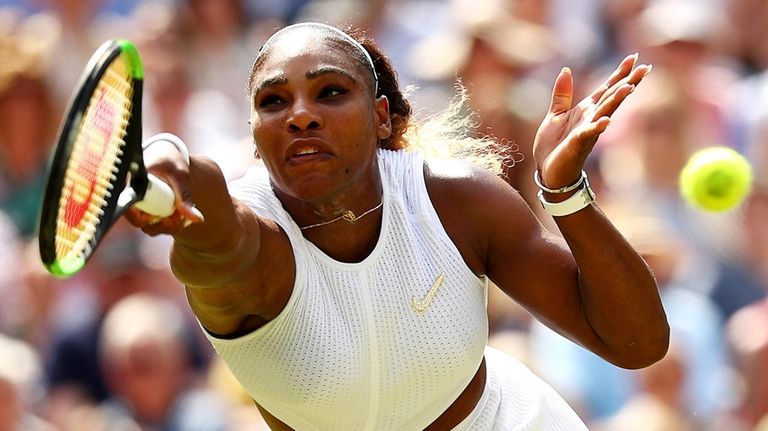 Serena Williams stretches to play a forehand in