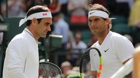 Spain's Rafael Nadal and Switzerland's Roger Federer, left,
