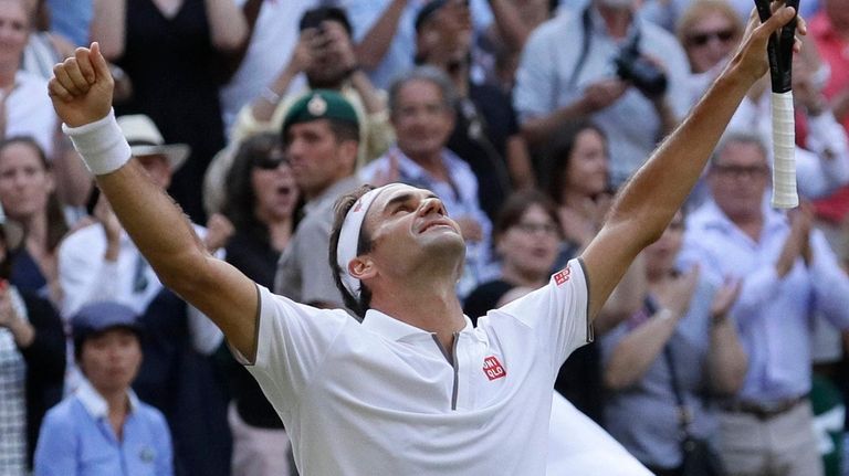 Roger Federer celebrates after beating Rafael Nadal in