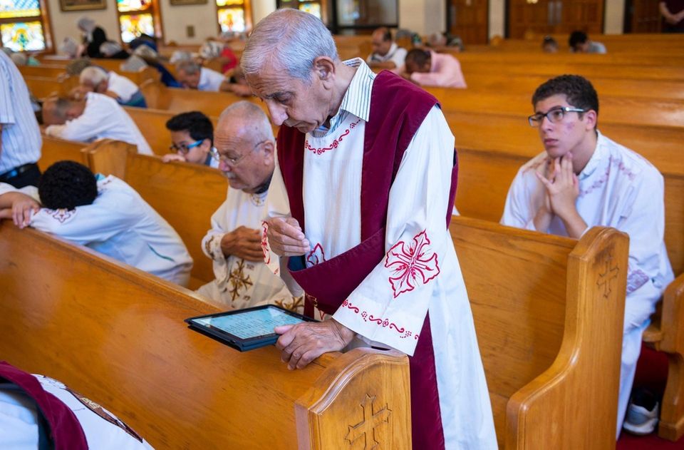Parishioners celebrate mass at the St. Abraam Coptic
