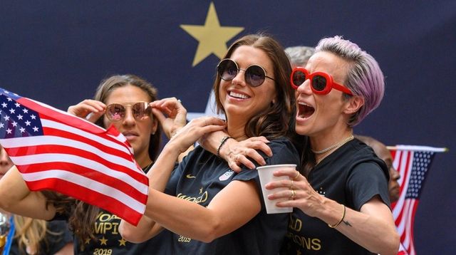 U.S. Women's Soccer team members Alex Morgan (c.)... U.S. Women's Soccer team members Alex Morgan (c.)