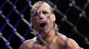 Urijah Faber celebrates after defeating Ricky Simon during