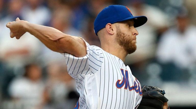Mets pitcher Zack Wheeler delivers during the first