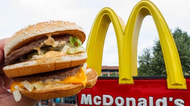 A McDonald's Big Mac, held up near the... A McDonald's Big Mac, held up near the