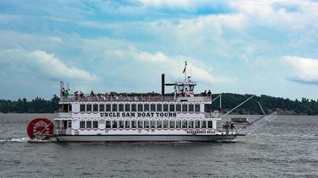 A steamboat travels the waters of the St.
