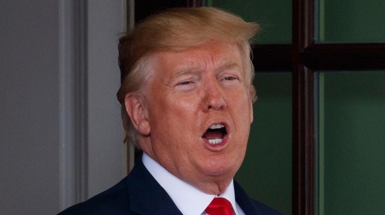 President Donald Trump calls to the media as