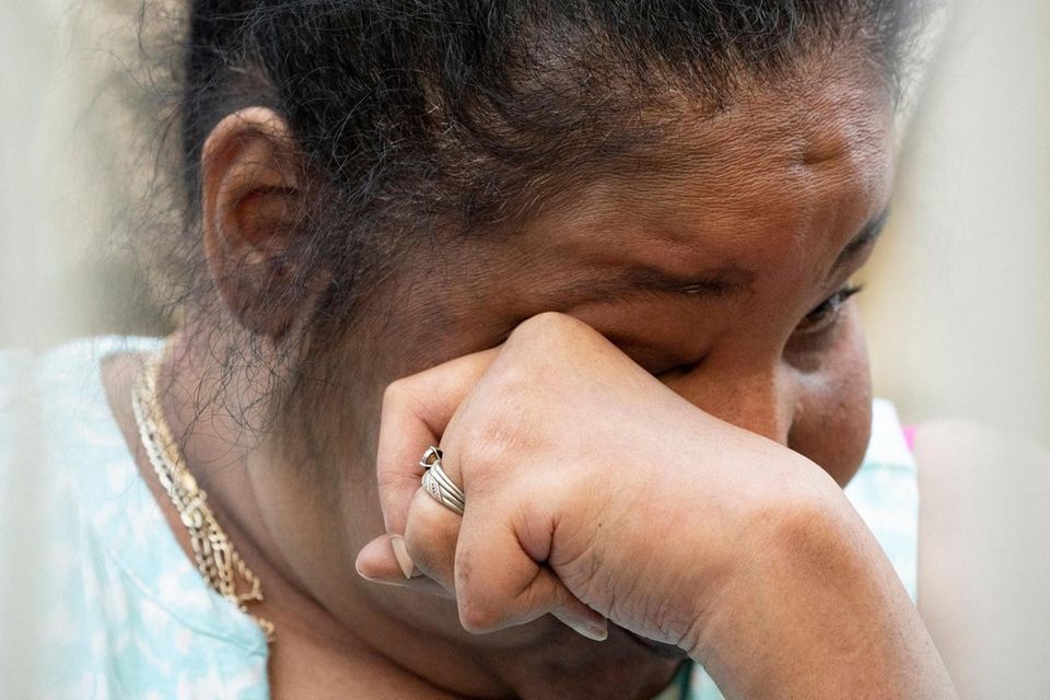 Esaw Snipes, the widow of Eric Garner, wipes