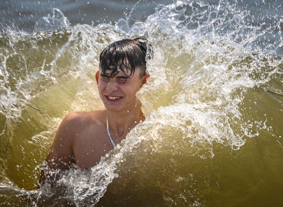 A man tries to handle the large wave