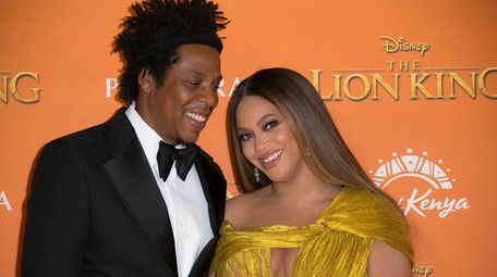 Jay-Z, left, and Beyoncé at the "Lion King"