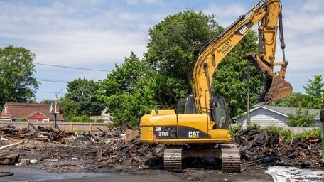 Piles of construction equipment are removed from the